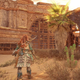 Aloy stands next to a temple in the desert in Horizon Forbidden West on PS5.